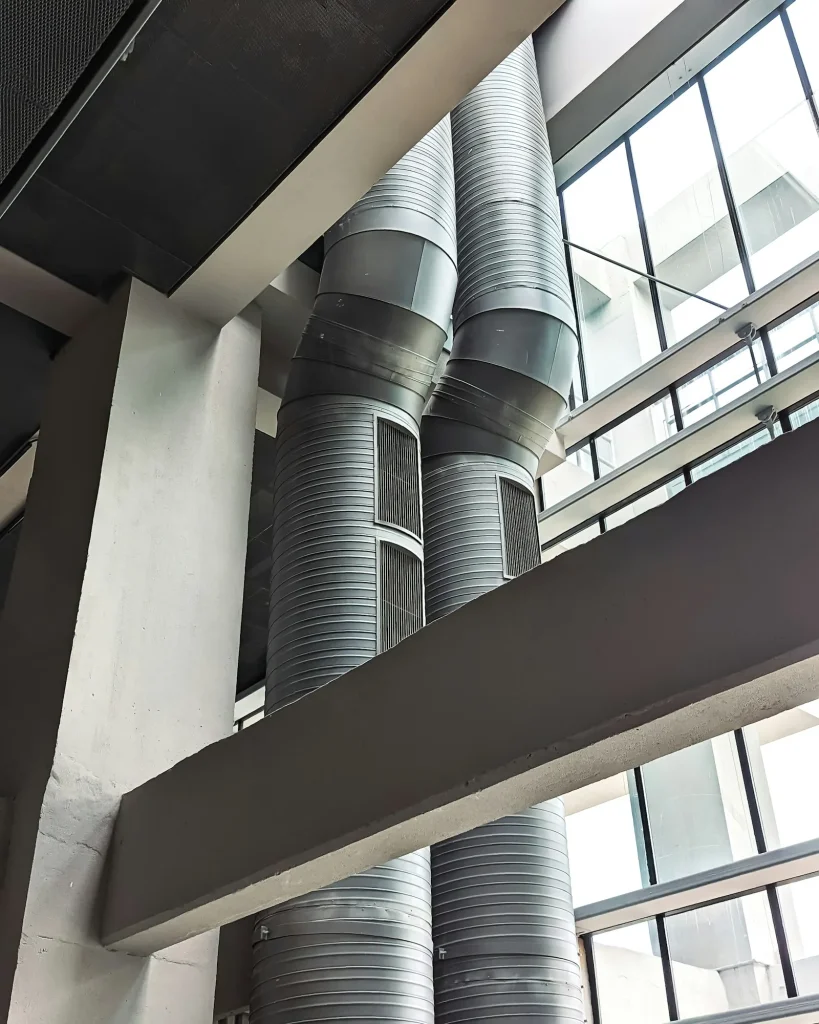 Spiral metal AC air ducts that carry cooled air through a modern building