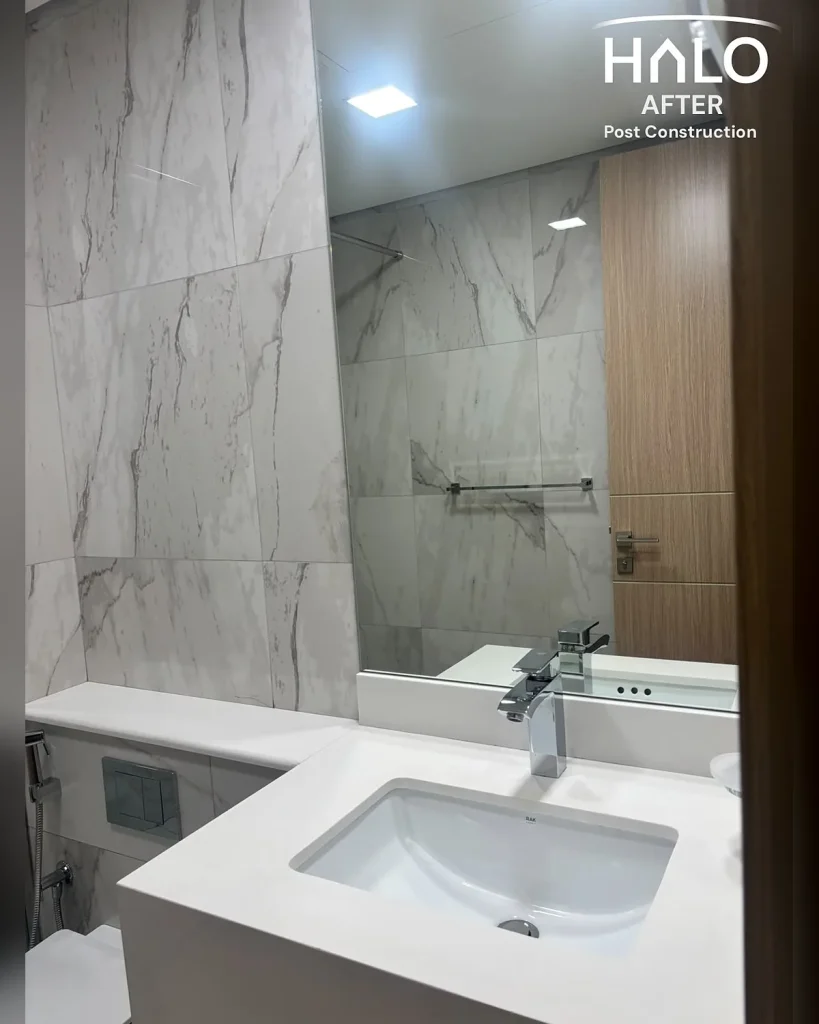 End of tenancy deep clean in Ras Al Khaimah - sparkling bathroom with polished glass, streak free mirror and sanitised basin