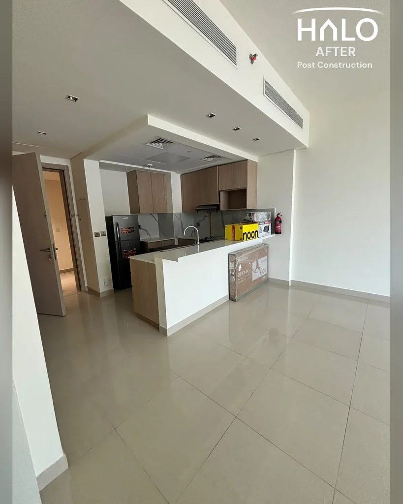 Post construction deep cleaning in Ras Al Khaimah - living room and open kitchen cleared of builders dust and debris