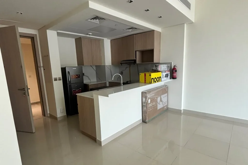 Post construction deep cleaning in Ras Al Khaimah - living room and open kitchen cleared of builders dust and debris