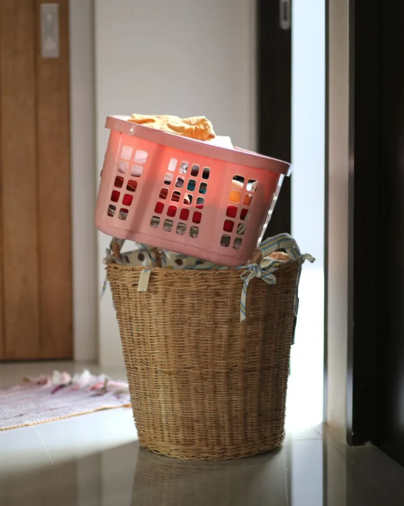 A full laundry basket left by the front door of a Ras Al Khaimah home, waiting for the Halo Clean driver to collect it